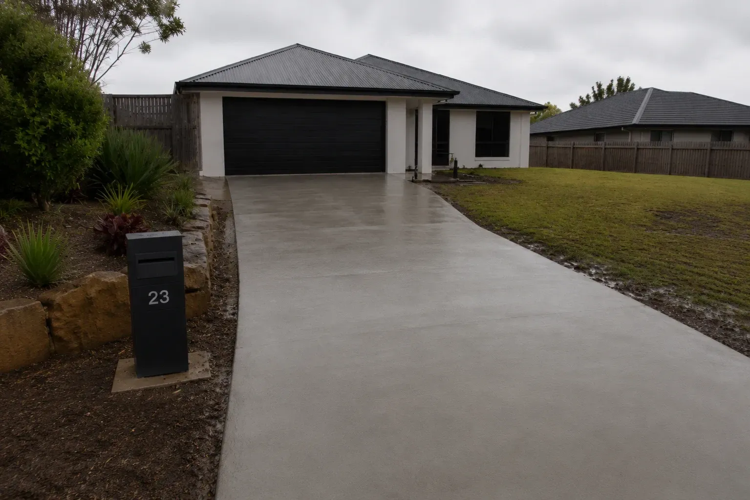 Recently completed plain concrete driveway in Drayton, Toowoomba