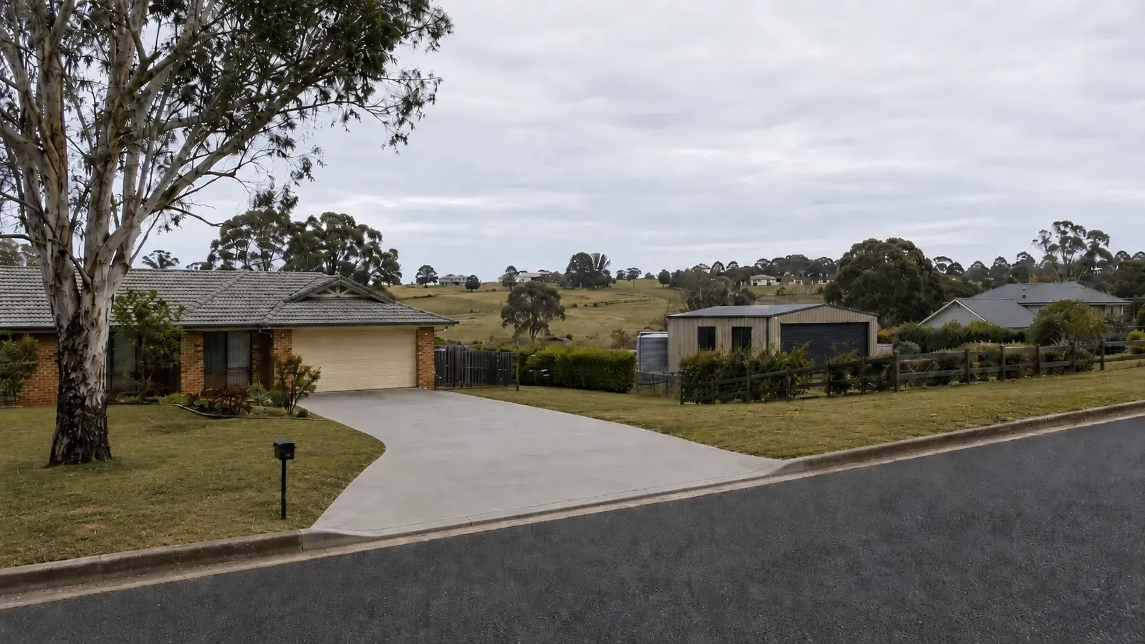 New plain concrete driveway built to replace a badly worn original driveway in Glenvale near Toowoomba.