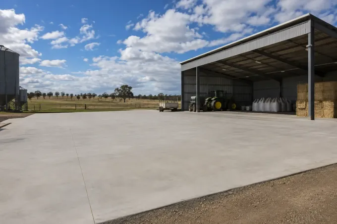 Concrete hardstand in front of large feed shed near Crows Nest in the Darling Downs, QLD