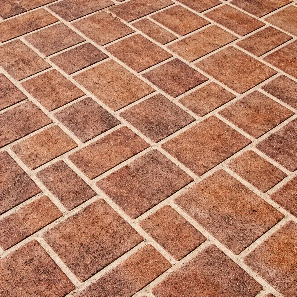 A close-up of a textured stencilled concrete patio slab. Toowoomba Concreter.