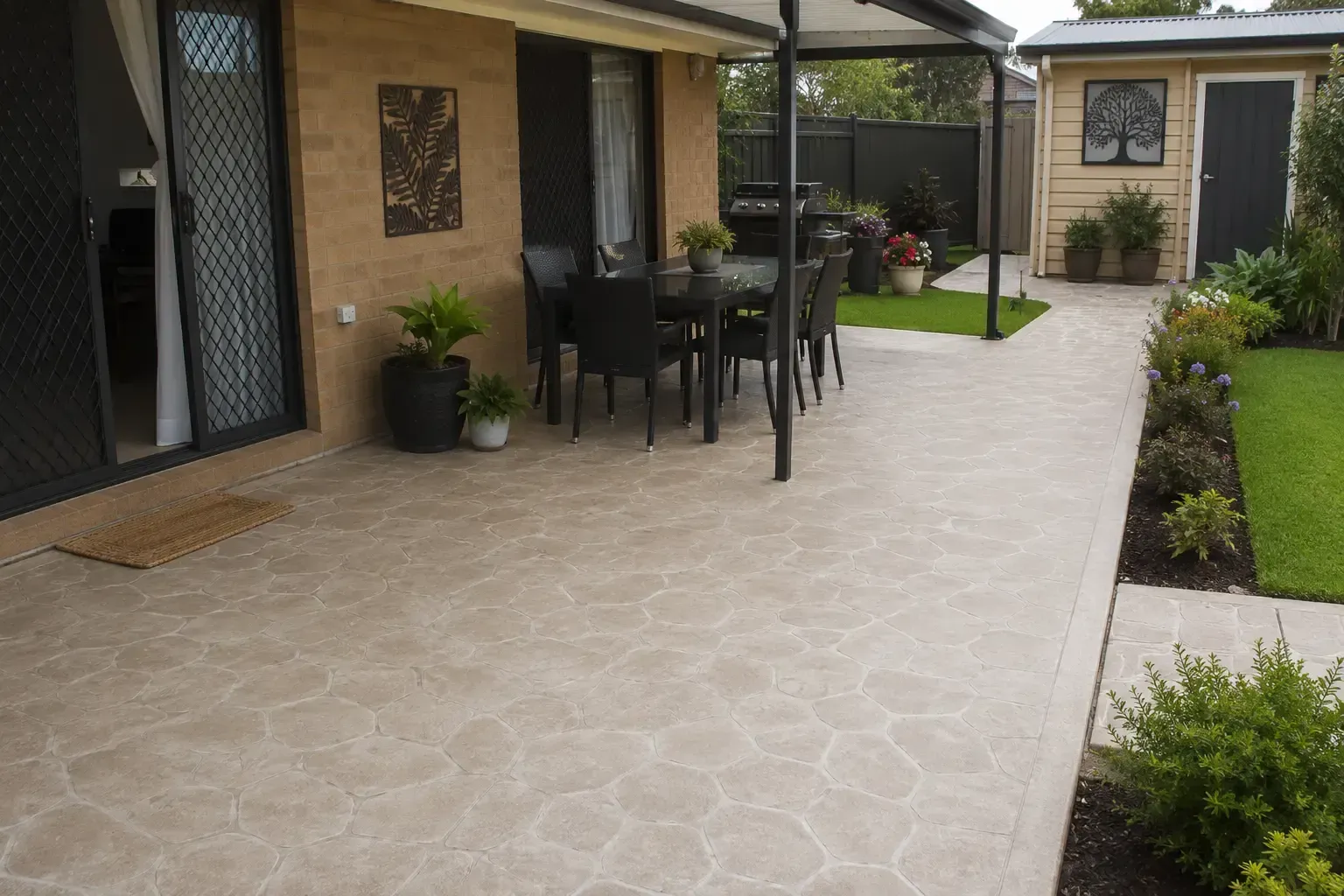 Matching stencilled concrete patio and pathways at this Kearneys Spring property, in Toowoomba.