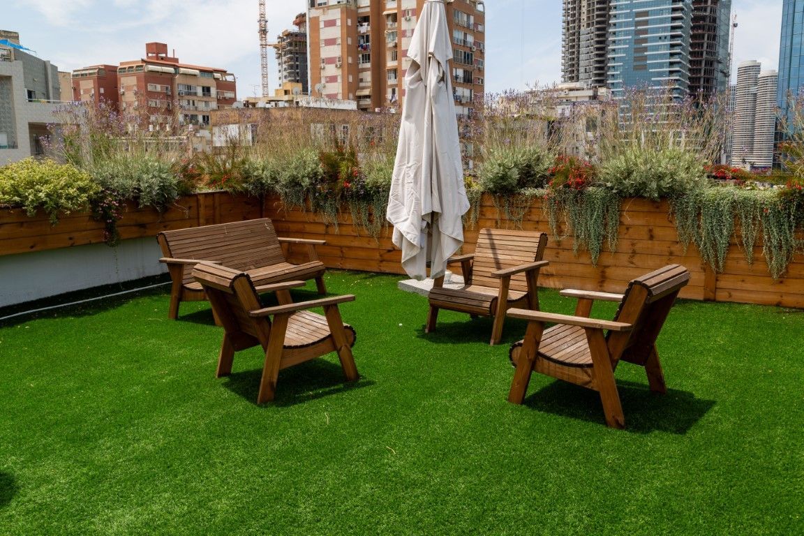 Professional artificial grass installation in a backyard.