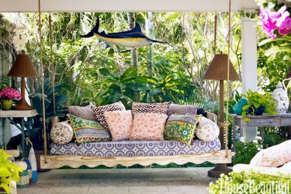 Textiles that can easily be moved indoors for winter bring this space alive for warmer weather. 
