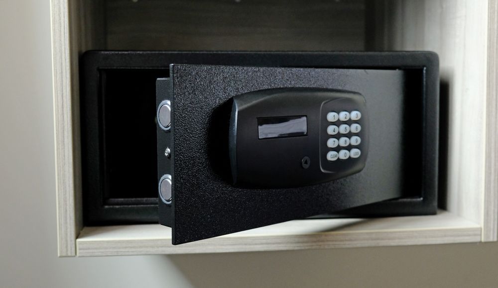 A Digital Safe Is Sitting on Top of A Wooden Shelf — Century Locksmiths In Clifton, QLD