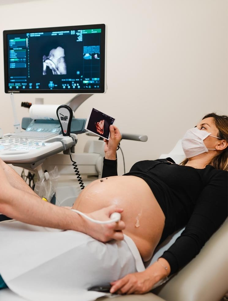 Pregnant Woman Watching Ultrasound — Glendale, CA — Maternity Imaging Pregnant Woman Watching Ultrasound — Glendale, CA — Maternity Imaging