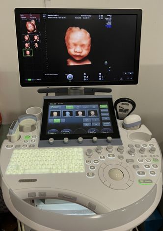 Pregnant Couple with Ultrasound Images — Glendale, CA — Maternity Imaging