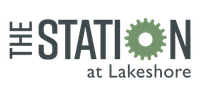 The Station at Lakeshore logo with gray text and a green gear.
