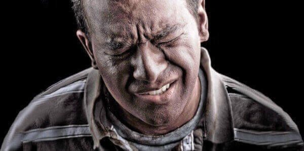 man with pain in his face