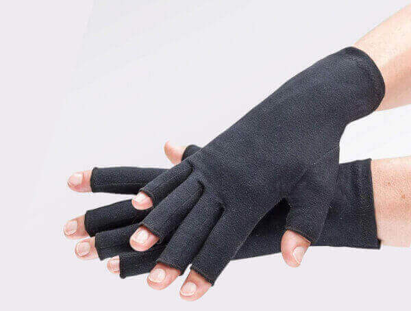 two hands with black compression gloves