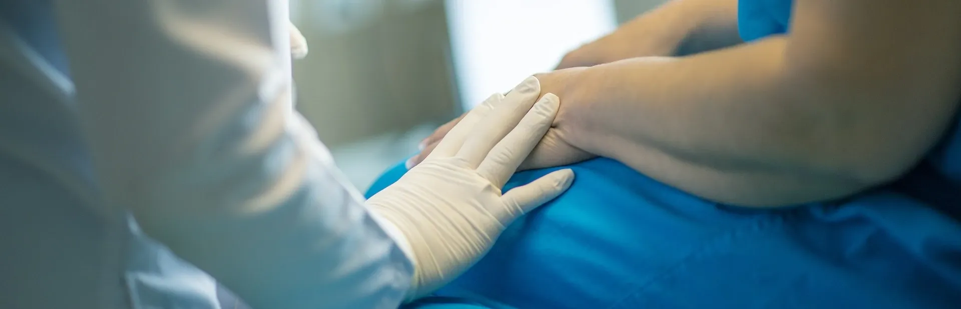 doctor comforts a patient