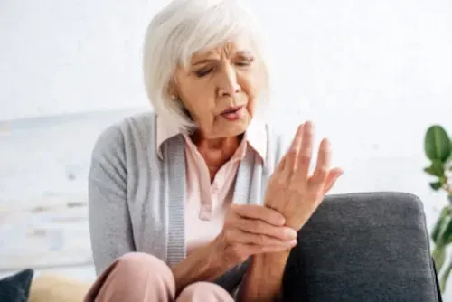 older woman with hand pain