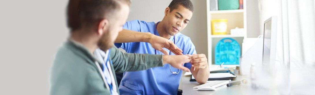 doctor assessing a hand and wist