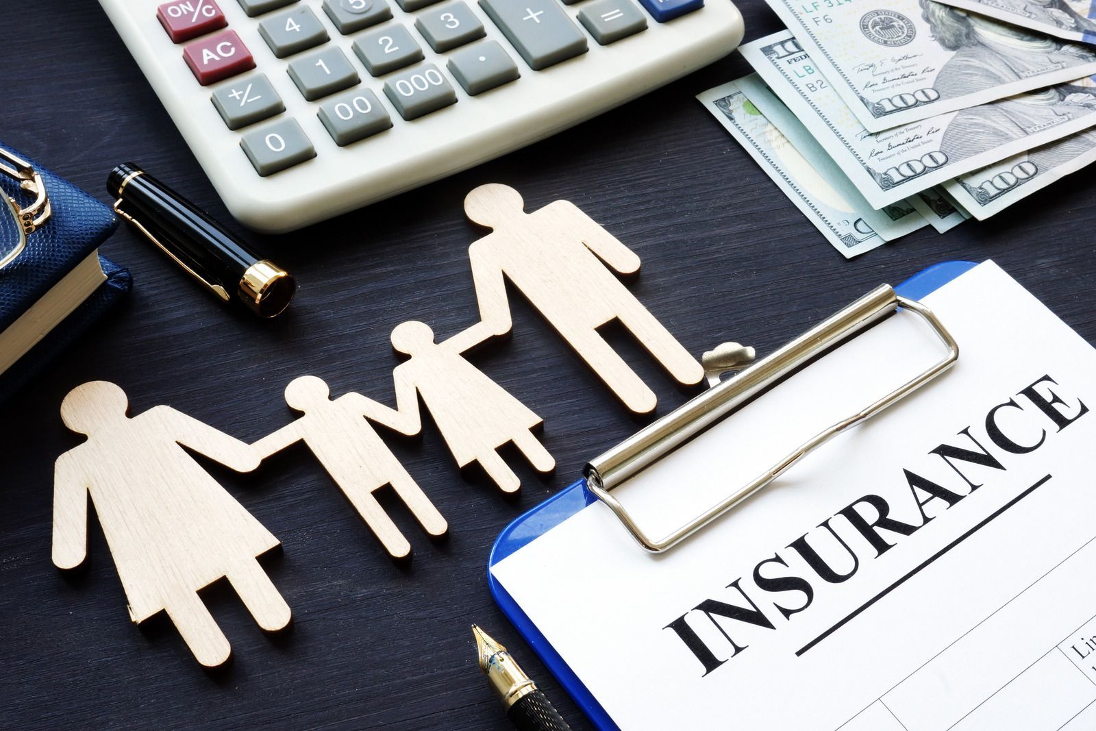 A clipboard with the word insurance written on it