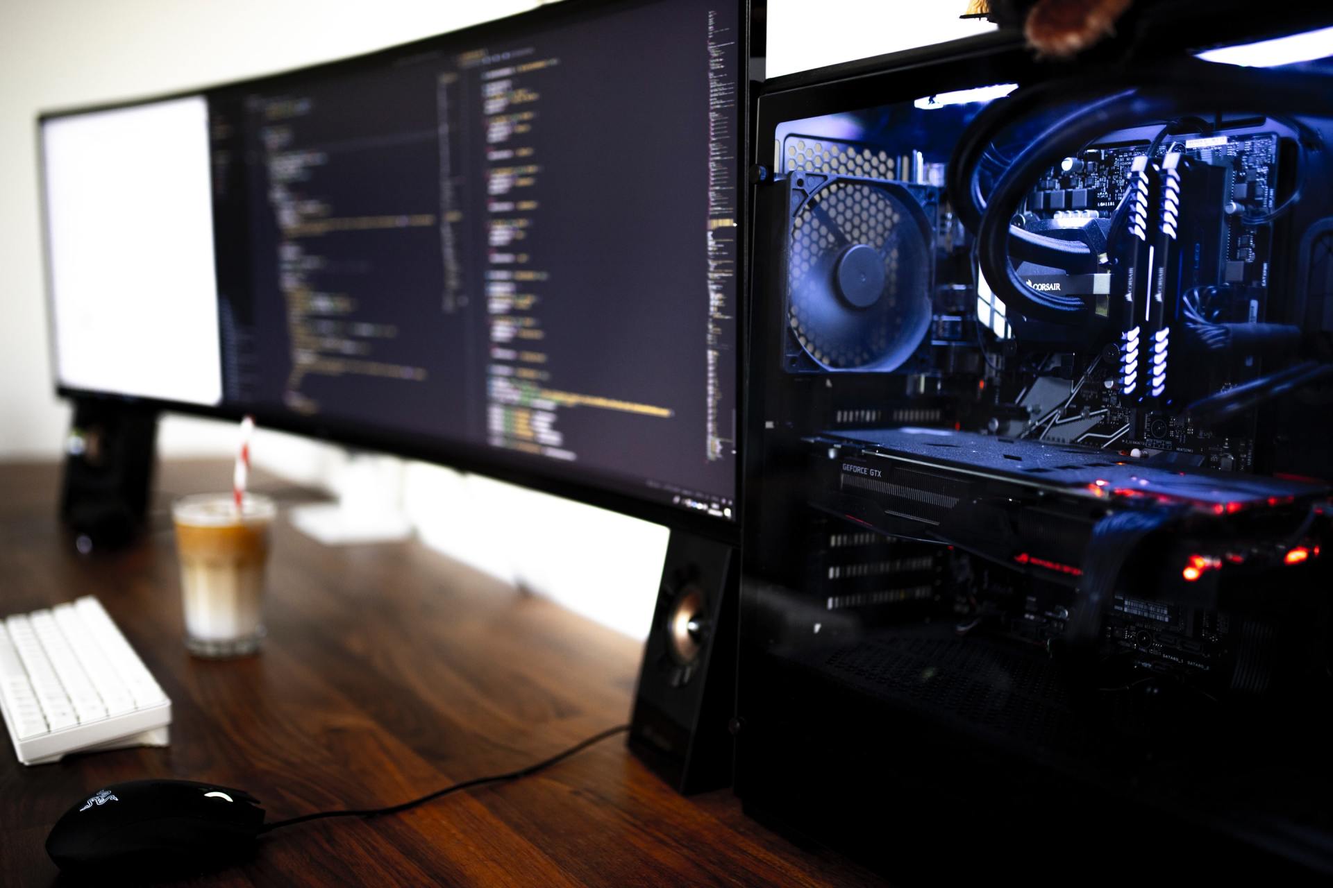 Computer and Monitor Displaying Code
