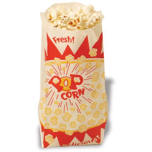 A popcorn machine filled with popcorn on a white background