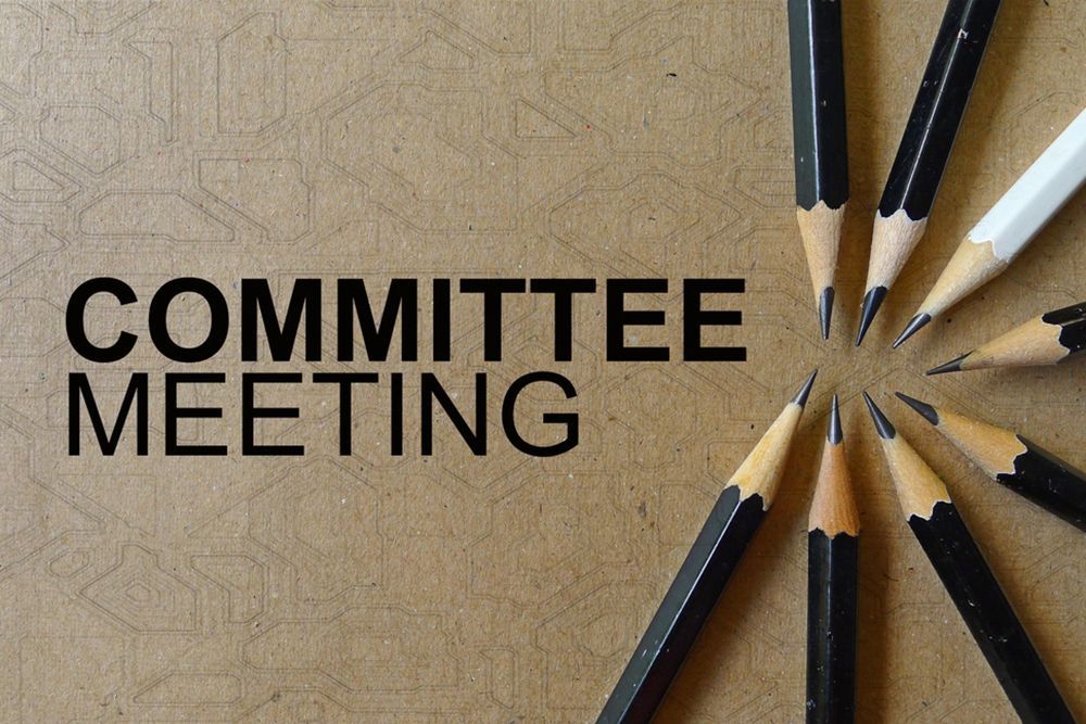 Committee Meeting text next to a circle of pencils