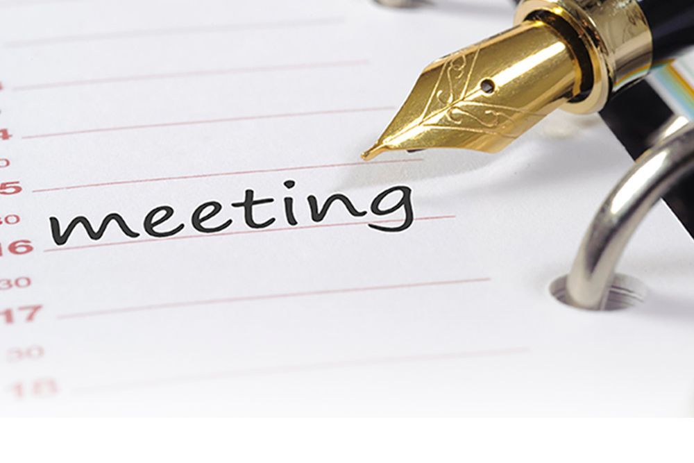 Calligraphy pen next to time in notebook marked as