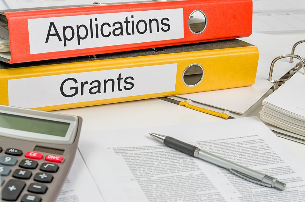 Two folders, one red for Applications and one yellow for Grants