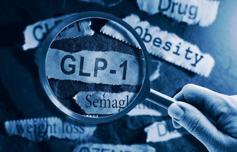 Magnifying glass over GLP-1 and semaglutide text, with obesity and weight loss labels in the background