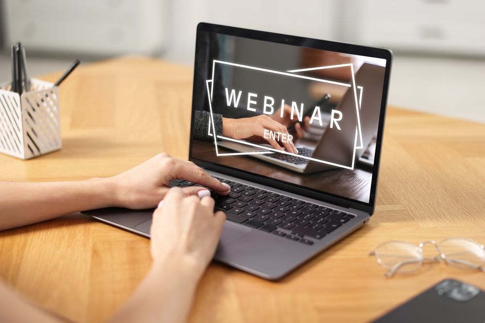 Person using laptop with box on screen showing