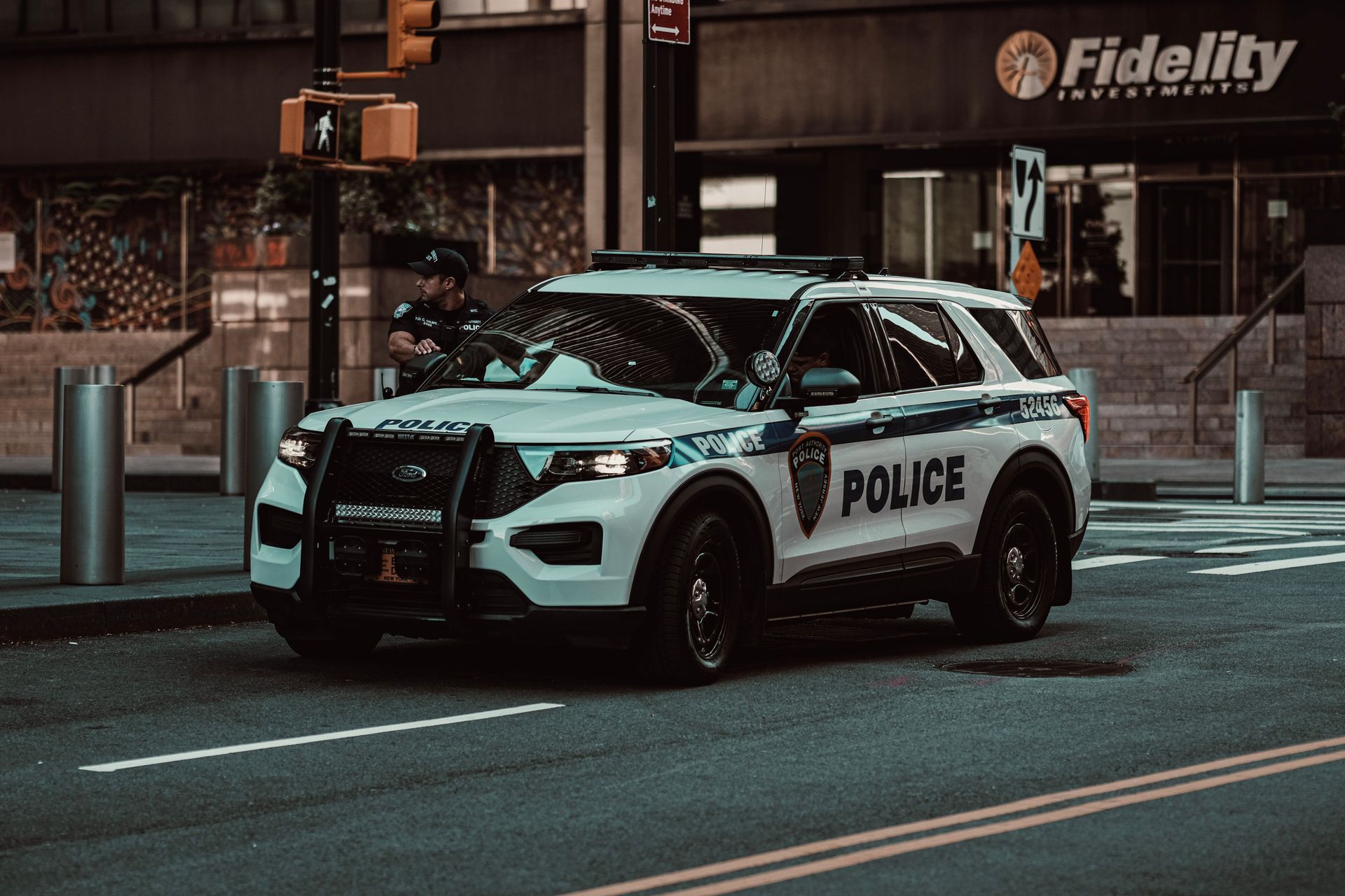 Police car parked in inner city intersection
