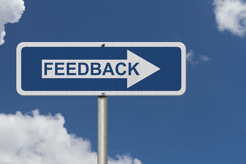 Blue sign with white arrow and