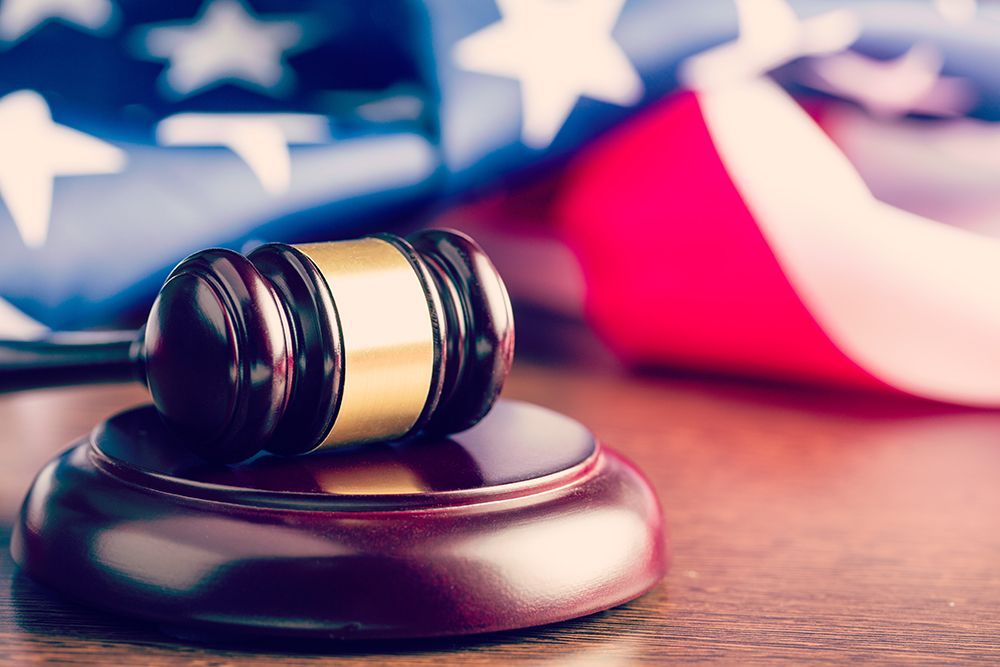 Gavel in front of folded American flag