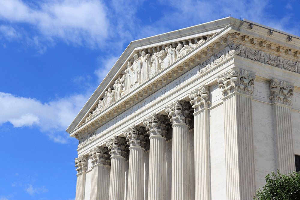 Front view of the US Supreme Court building on a sunny day