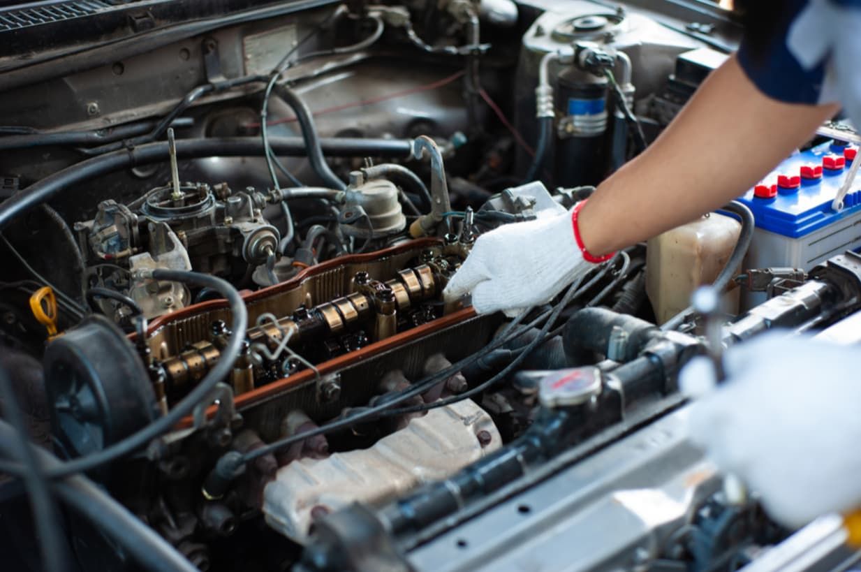 A Mechanic Is Working On The Engine Of A Car — North Queensland Diesel Tune In Kirwan, QLD