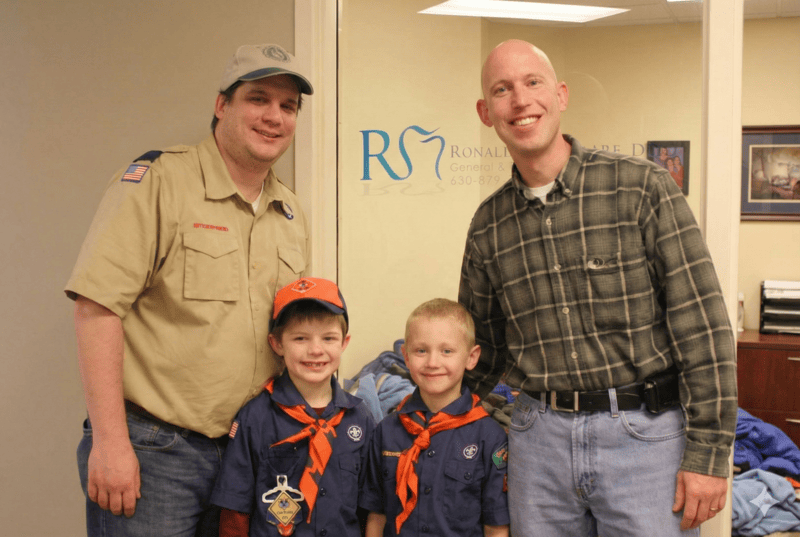 Dr. Murphy with kids with scout uniforms