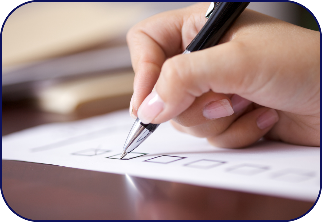 Hand of dental hygienist checks off items on dental care checklist