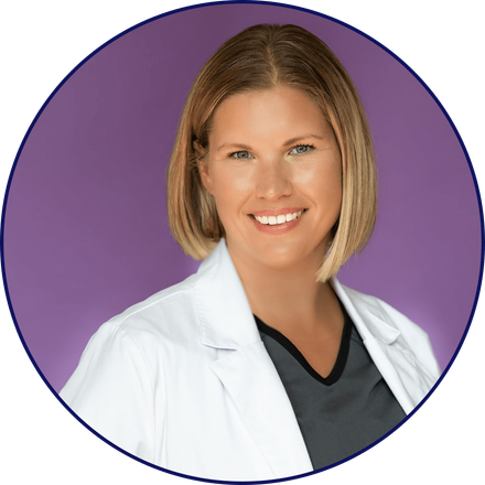 Dental hygienist Kelly Durst in a white coat