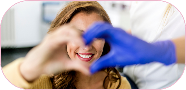 Patient and doctor forming a heart with their hands