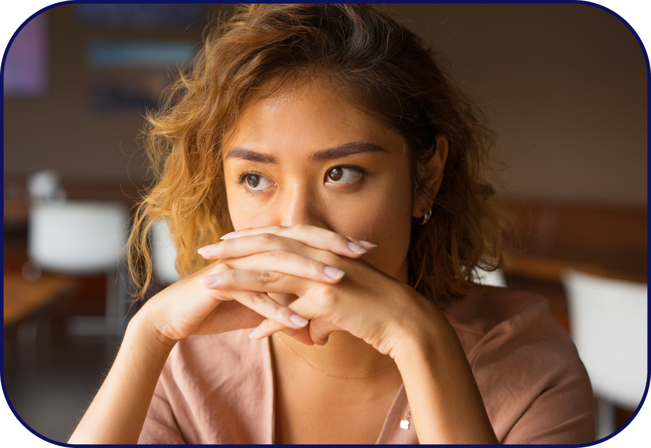 Woman covers her mouth due to lack of confidence in her smile