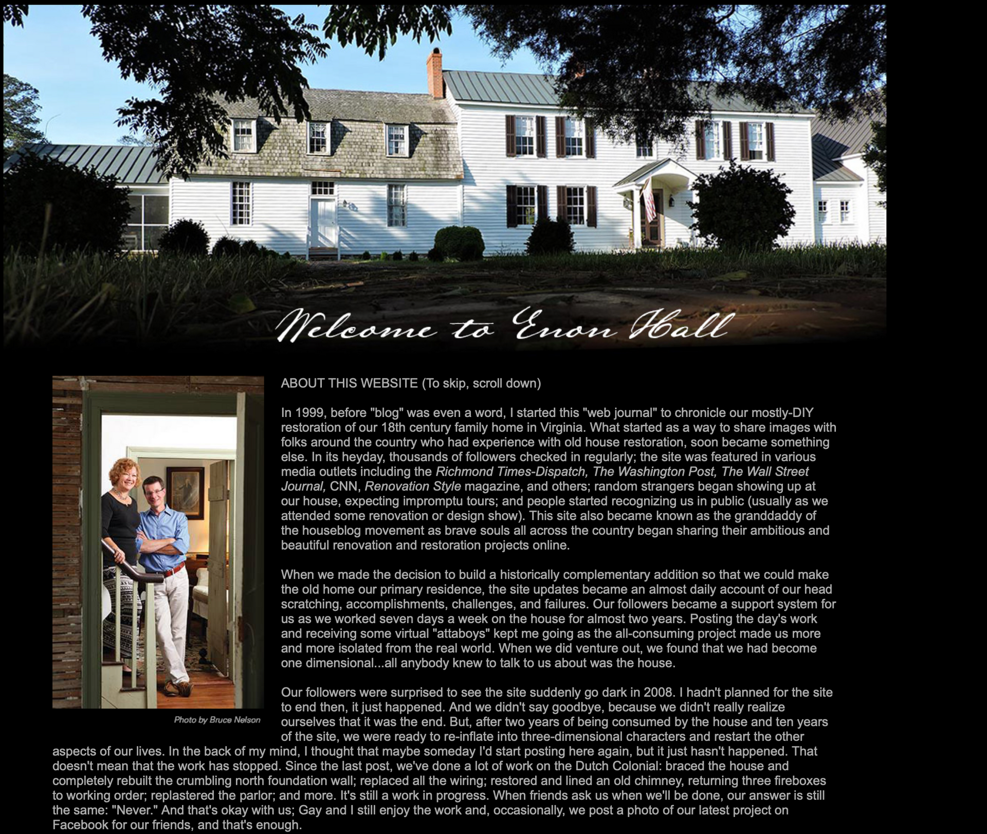 A couple standing in front of a house that says welcome to garden hall