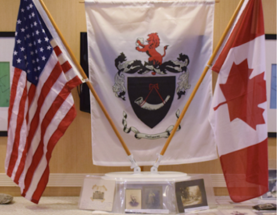 An american flag and a canadian flag are on a table