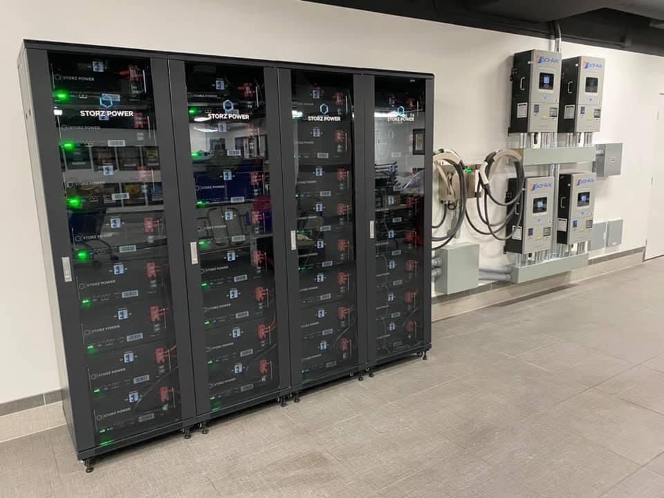 A row of servers sitting next to each other in a room.