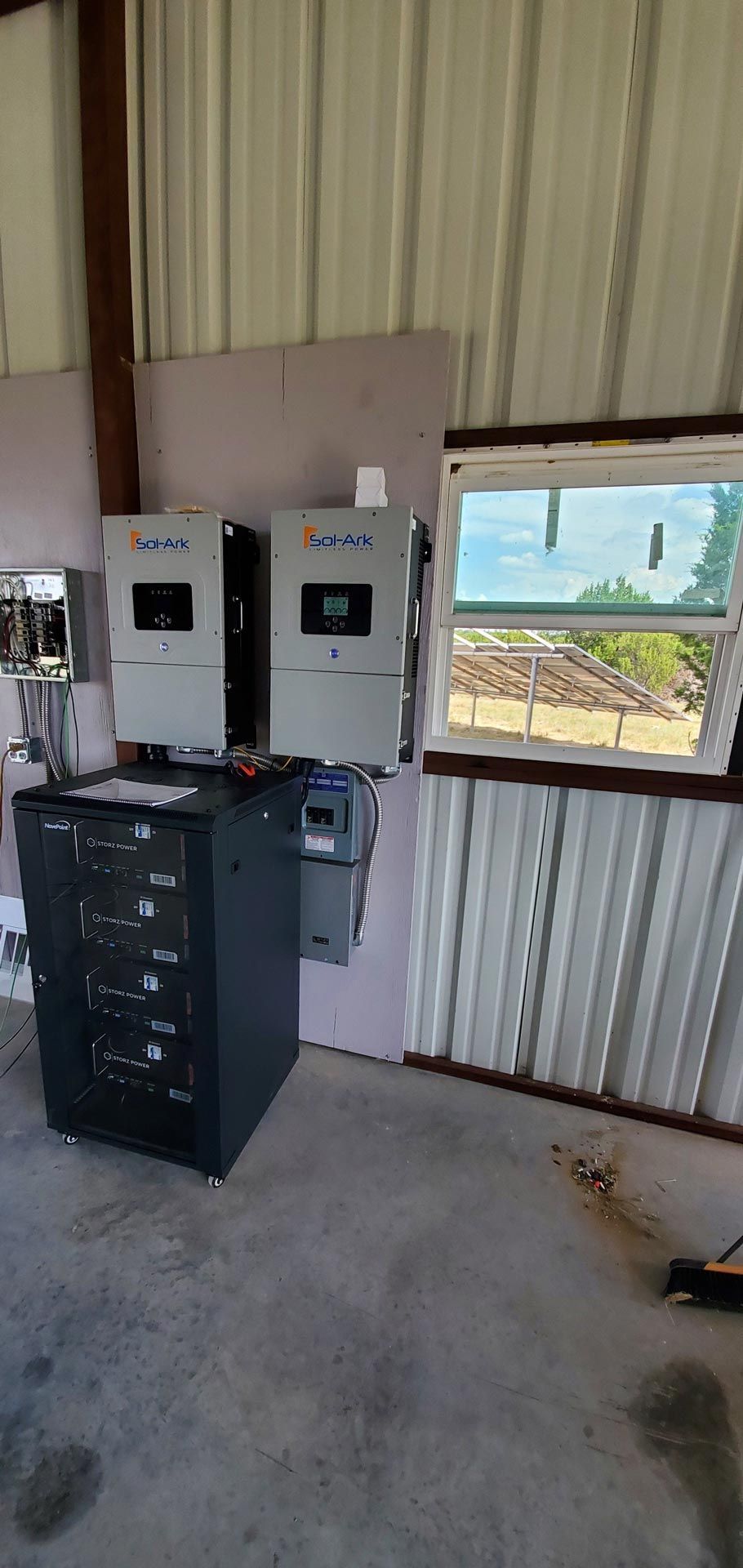 A room with a lot of electrical equipment and a window.