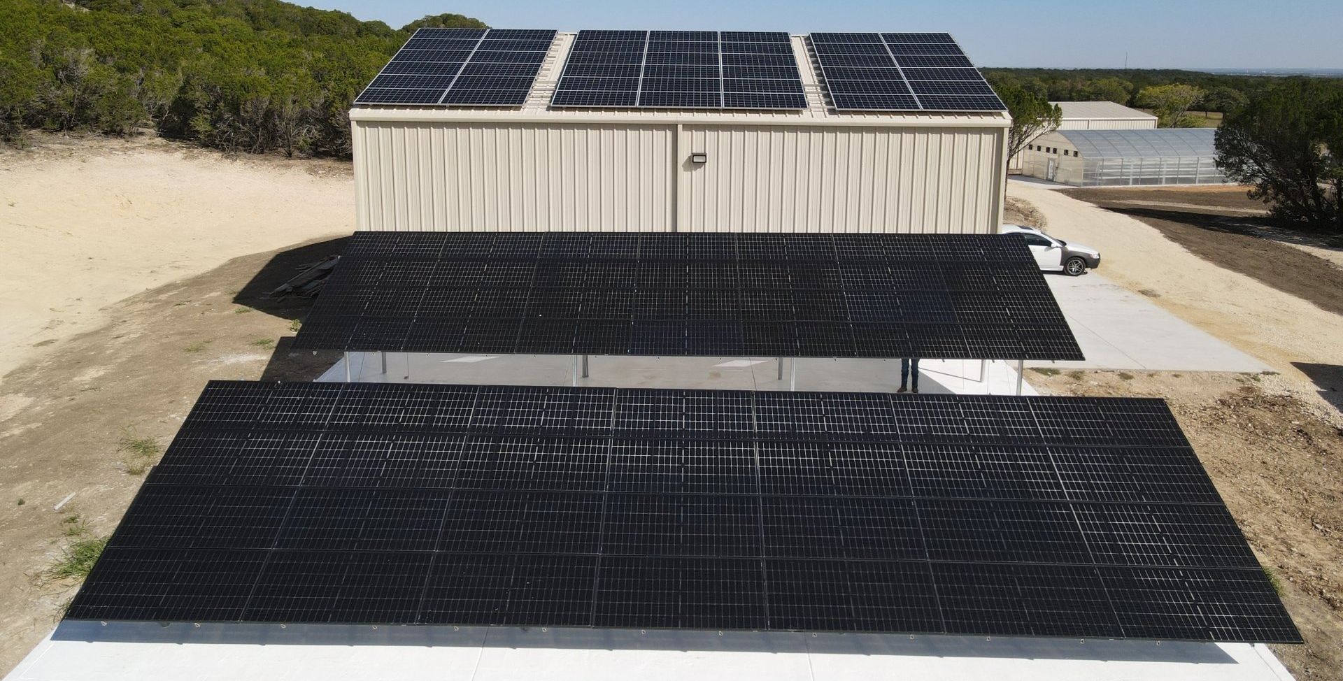A building with a lot of solar panels on the roof