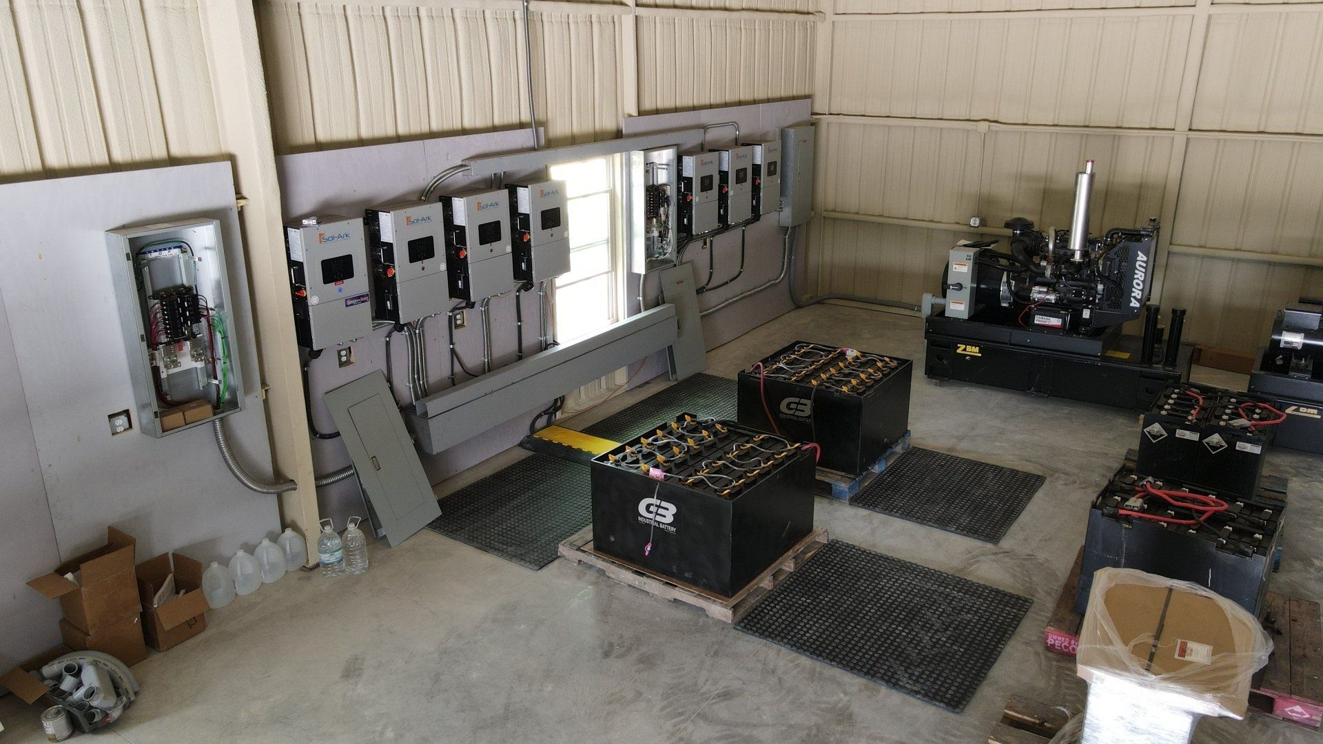 A warehouse filled with lots of electrical equipment and batteries.