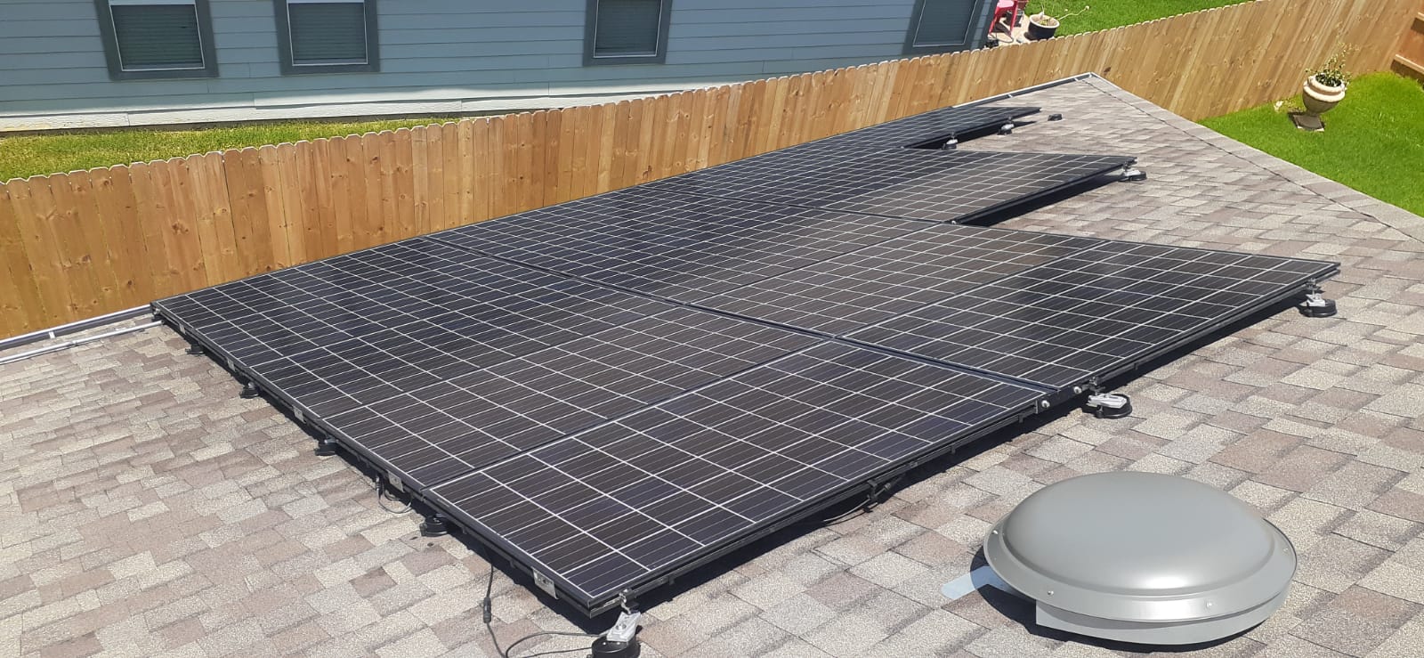A roof with a lot of solar panels on it