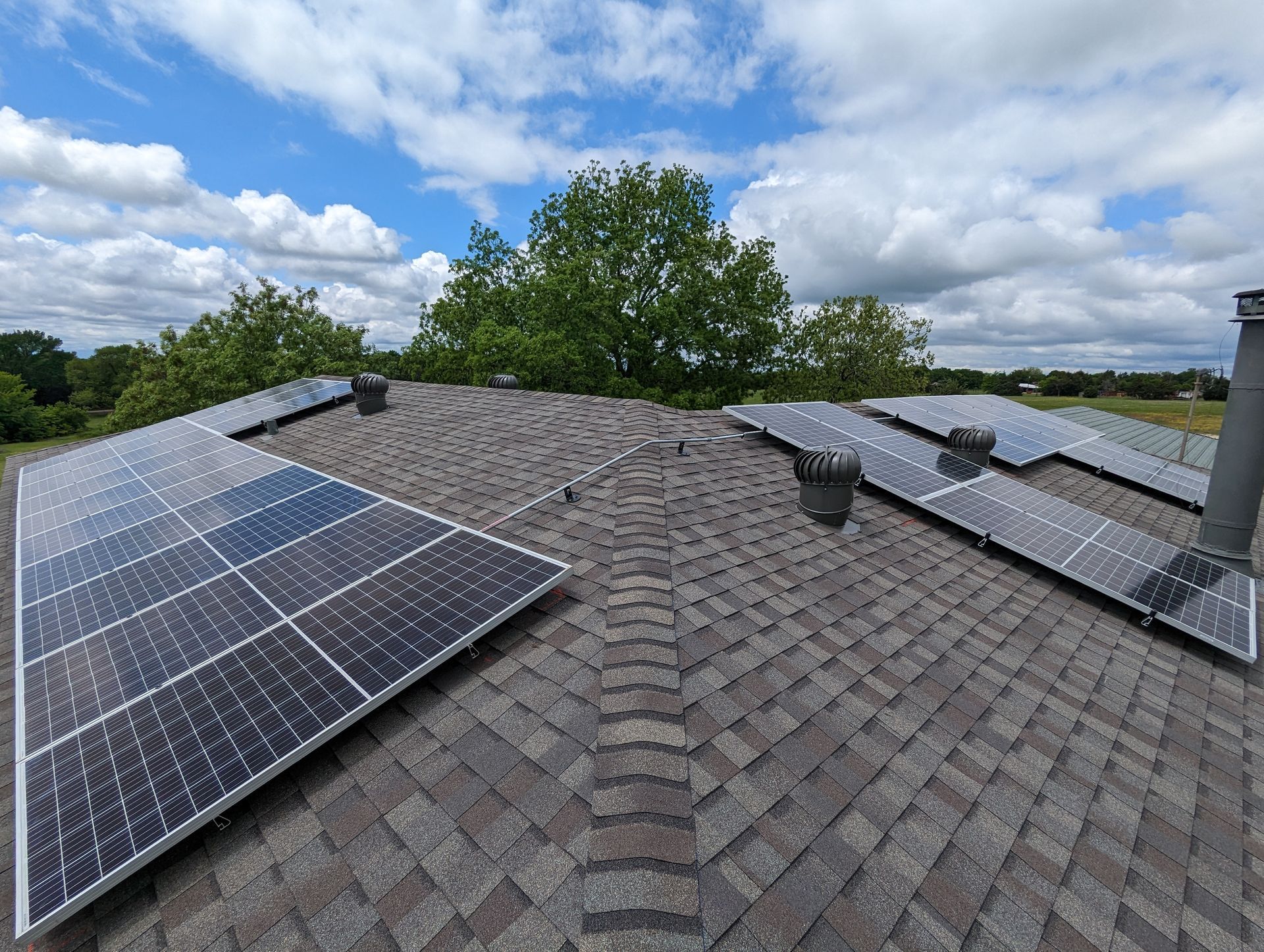 A roof with a lot of solar panels on it