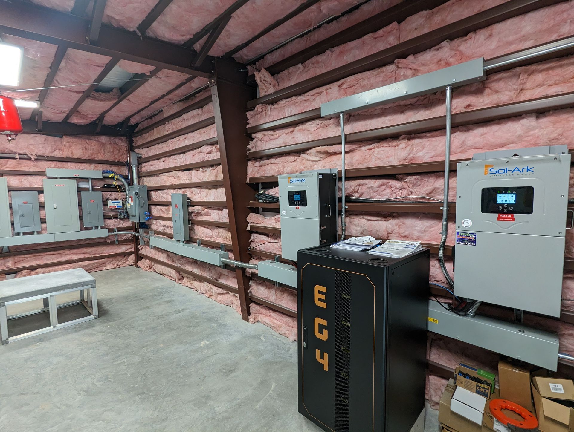 A room with a lot of electrical equipment in it.
