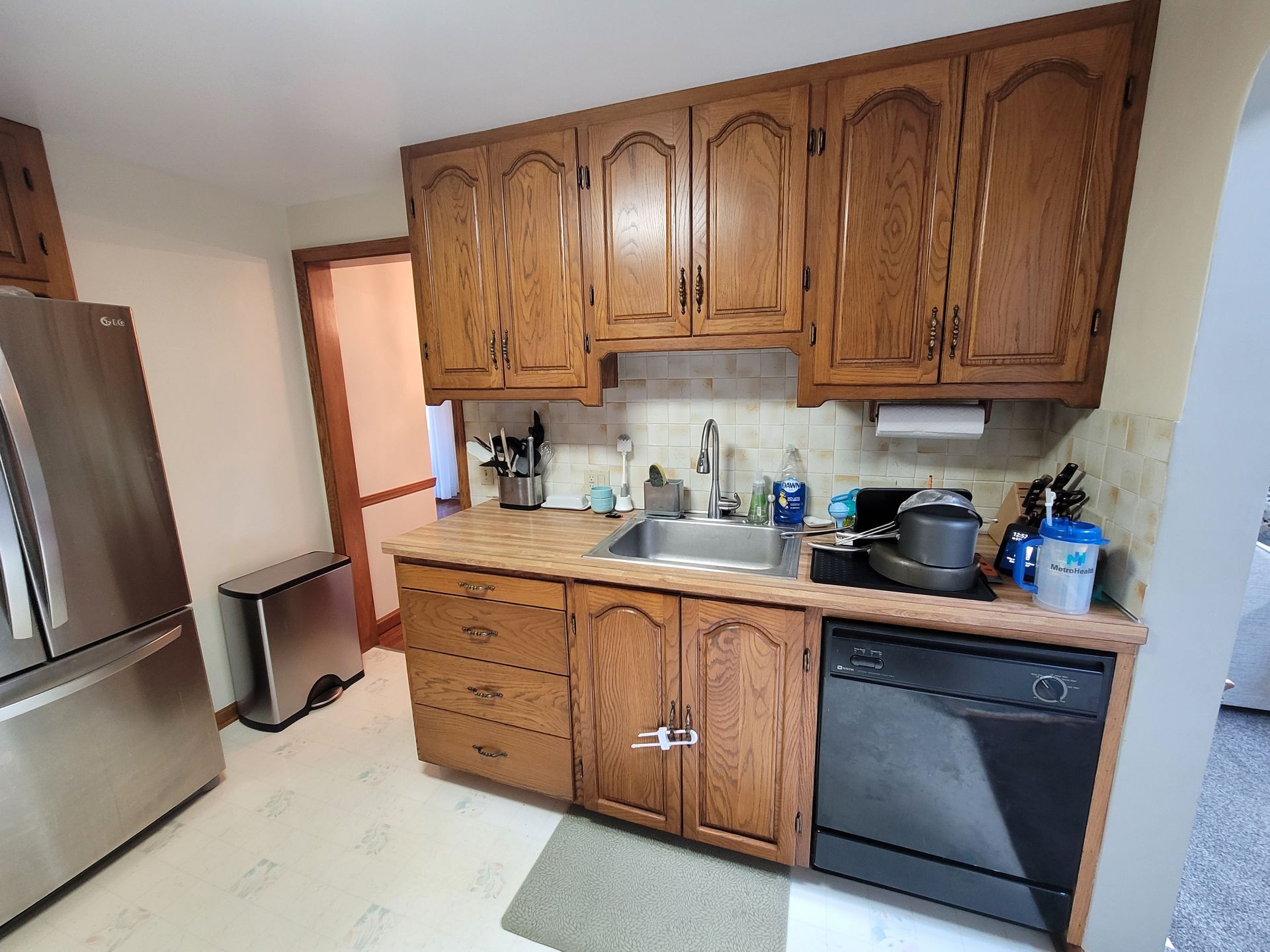 Kitchen with wooden cabinets, stainless steel appliances, and a dishwasher.