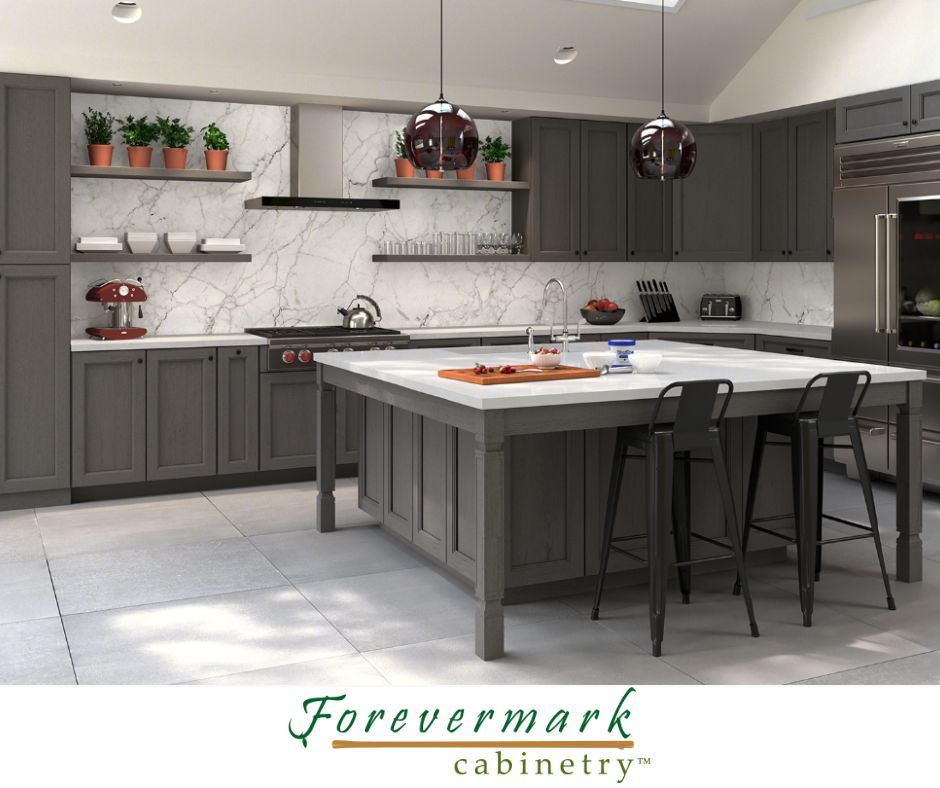 Modern kitchen with gray cabinets, white countertops, and a large island.