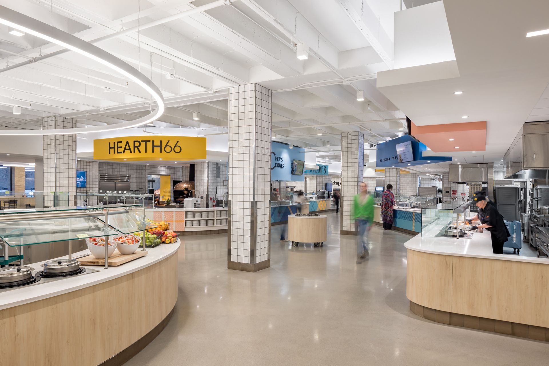A Large Food Court with a Yellow Sign that says Hearth46 | Wooster, OH | Bogner Construction Company