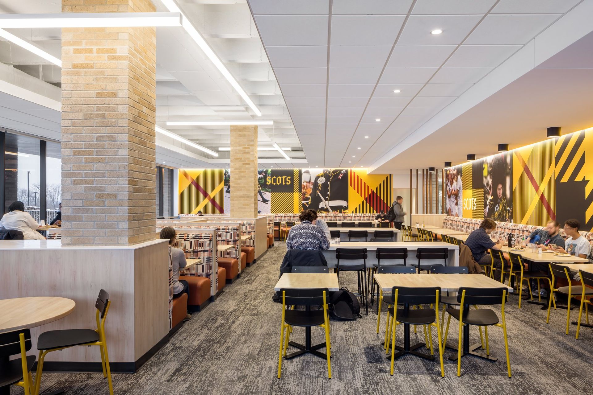 A Group of People are Sitting at Tables in a Restaurant | Wooster, OH | Bogner Construction Company