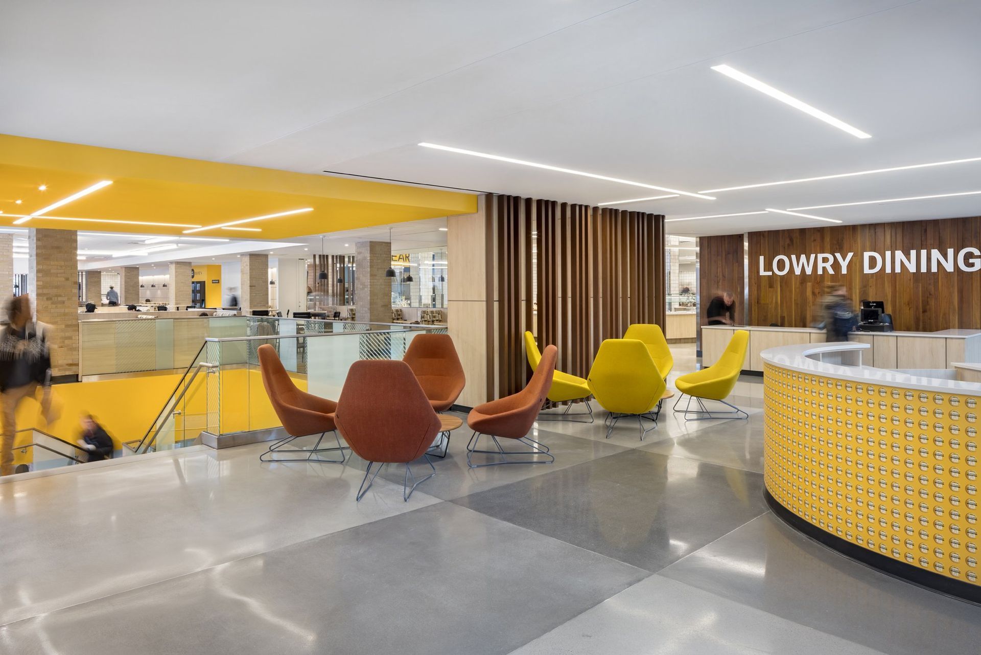 A Lobby with Chairs and a Sign that says Lowry Dining | Wooster, OH | Bogner Construction Company