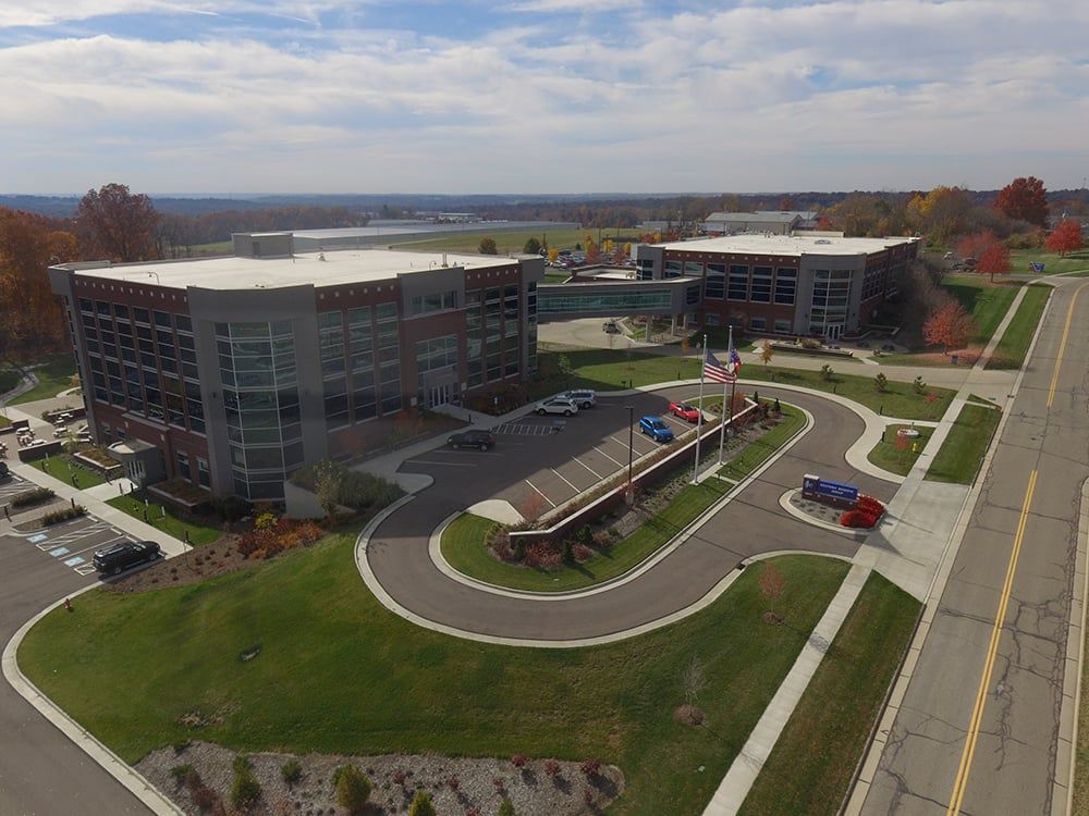 An Aerial View of a Large Building with a Lot of Cars Parked in Front of it | Wooster, OH | Bogner Construction Company