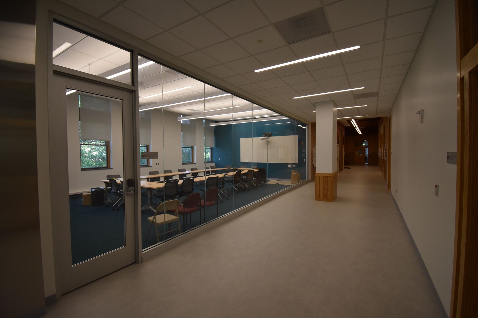 A Hallway Leading to a Room with Tables and Chairs | Wooster, OH | Bogner Construction Company